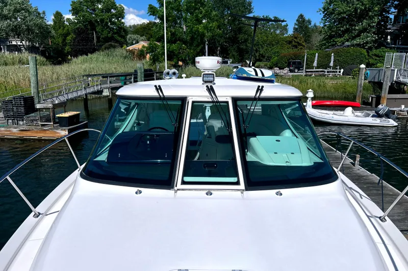  Yacht Photos Pics 2008 Tiara Yachts 3500 Sovran docked, showcasing sleek design and spacious cockpit.