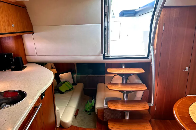  Yacht Photos Pics 2008 Tiara Yachts 3500 Sovran interior with wooden stairs and cozy seating area.