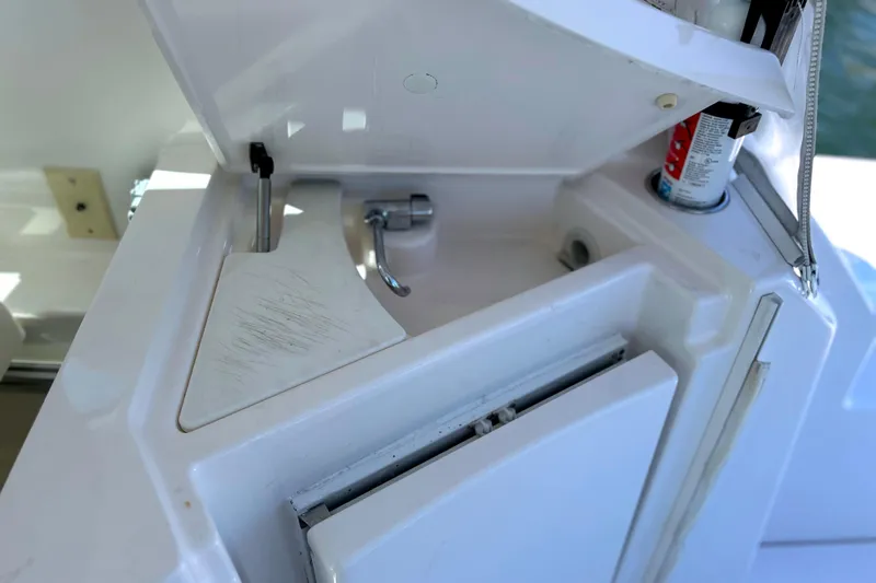  Yacht Photos Pics 2008 Tiara Yachts 3500 Sovran sink area with storage and cleaning supplies.