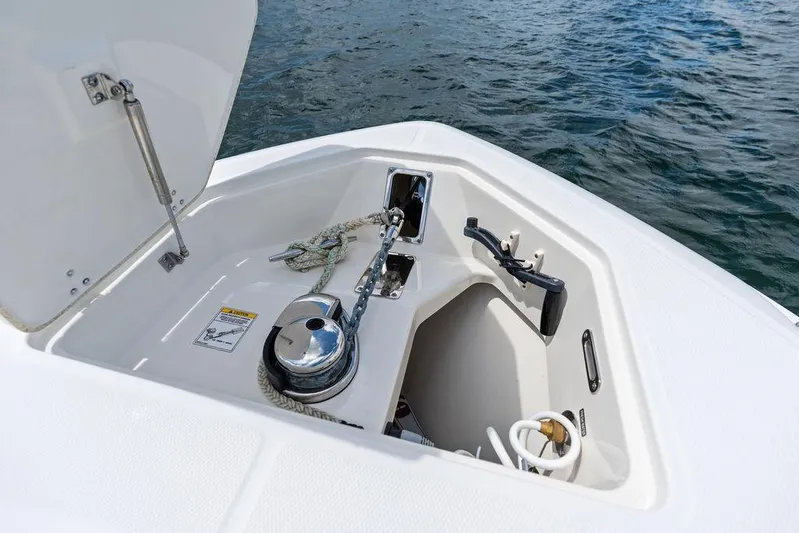 Zoom Yacht Photos Pics Open anchor compartment on 2022 Boston Whaler 280 Outrage, showing anchor and rope storage.