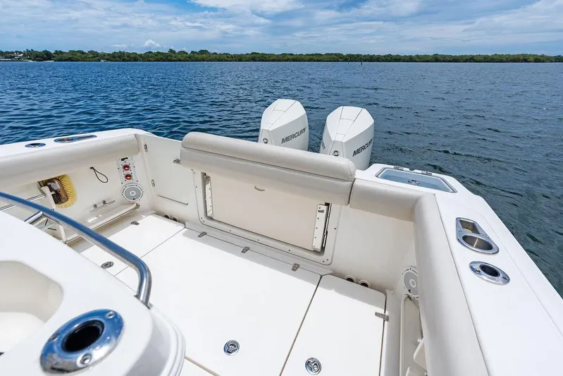 Zoom Yacht Photos Pics 2022 Boston Whaler 280 Outrage boat with dual Mercury engines on open water.