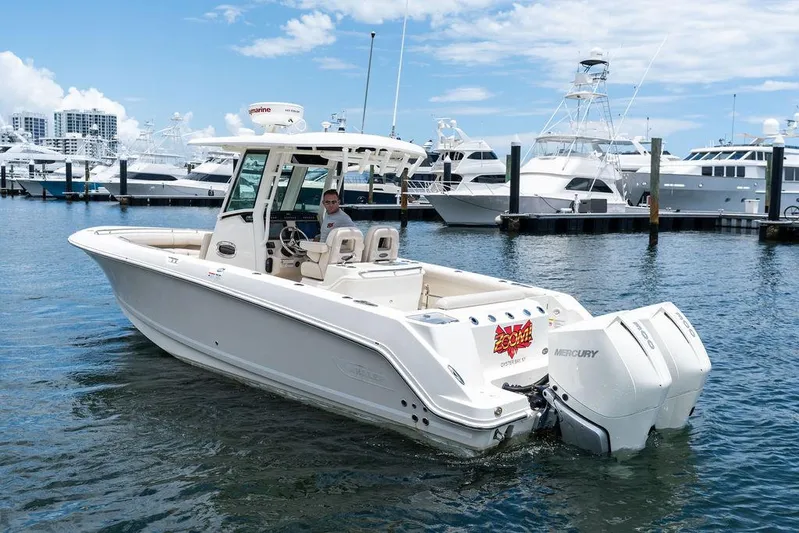 Zoom Yacht Photos Pics 2022 Boston Whaler 280 Outrage boat docked in marina with twin Mercury engines.