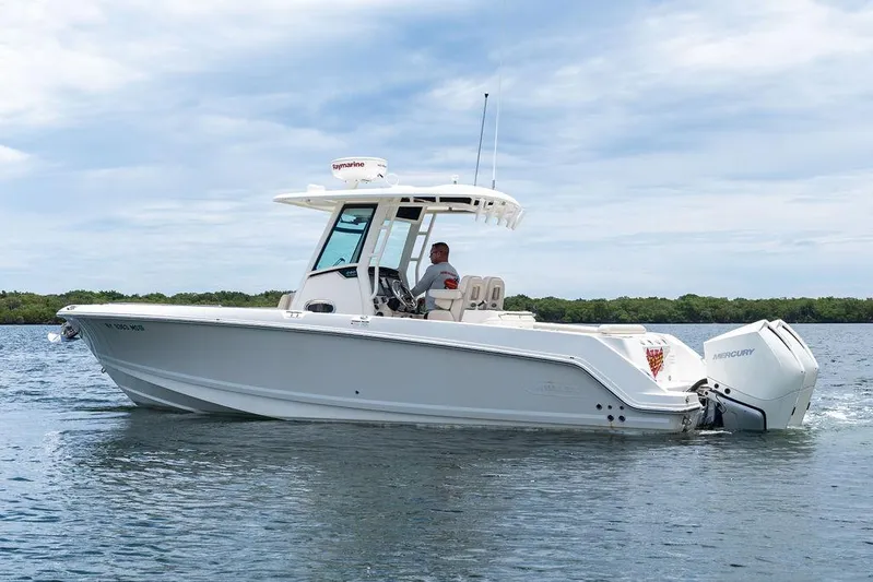 Zoom Yacht Photos Pics 2022 Boston Whaler 280 Outrage boat cruising on calm water.