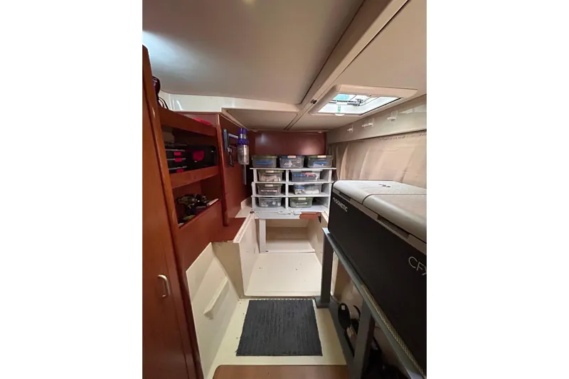  Yacht Photos Pics Interior of a 2013 Leopard 48 yacht with organized storage and modern amenities.