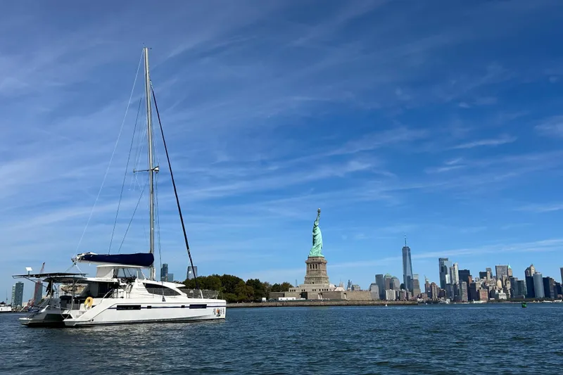  Yacht Photos Pics Leopard 48 yacht near Statue of Liberty with New York City skyline, 2013 model.