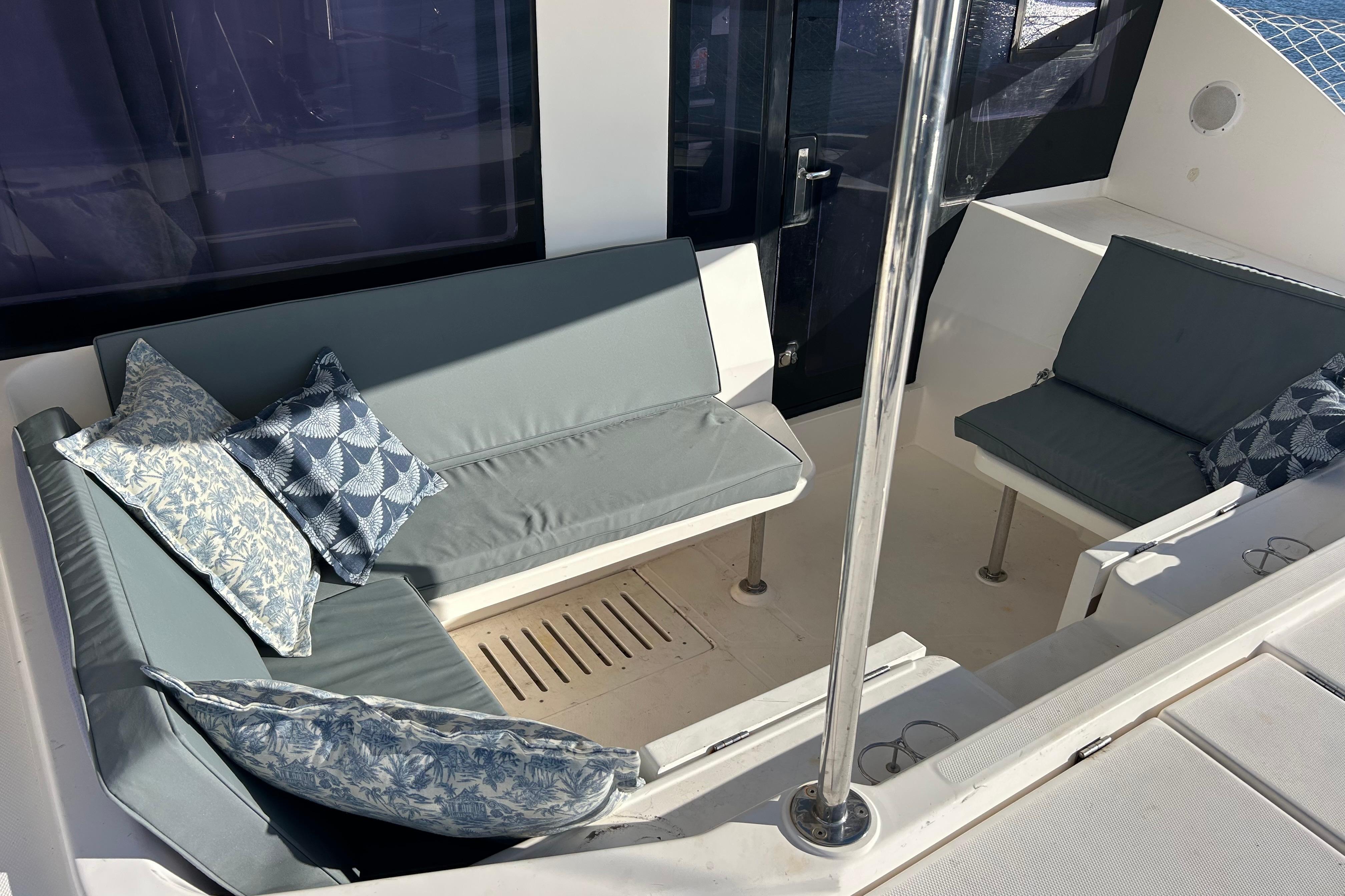 Luxurious seating area on a 2013 Leopard 48 yacht with stylish cushions.