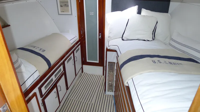 Dakota Yacht Photos Pics 1953 De Vries Lentsch 68 Motoryacht cabin with twin beds and nautical decor.