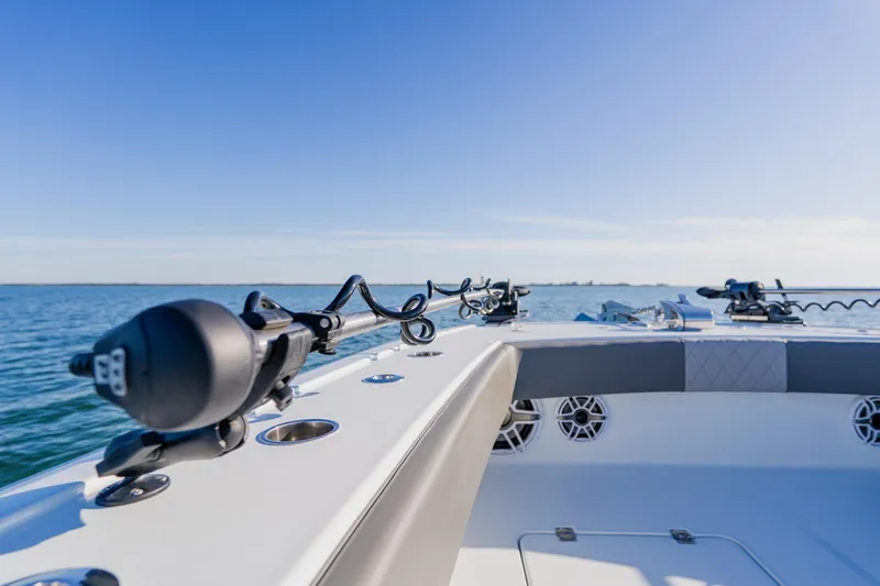 Reel Blessed Yacht Photos Pics Freeman 42LR 2025 boat on open water, showcasing sleek design and fishing equipment.