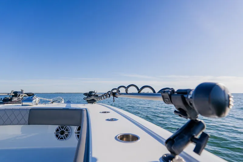 Reel Blessed Yacht Photos Pics 2025 Freeman 42LR boat on water, featuring advanced fishing equipment under clear blue sky.