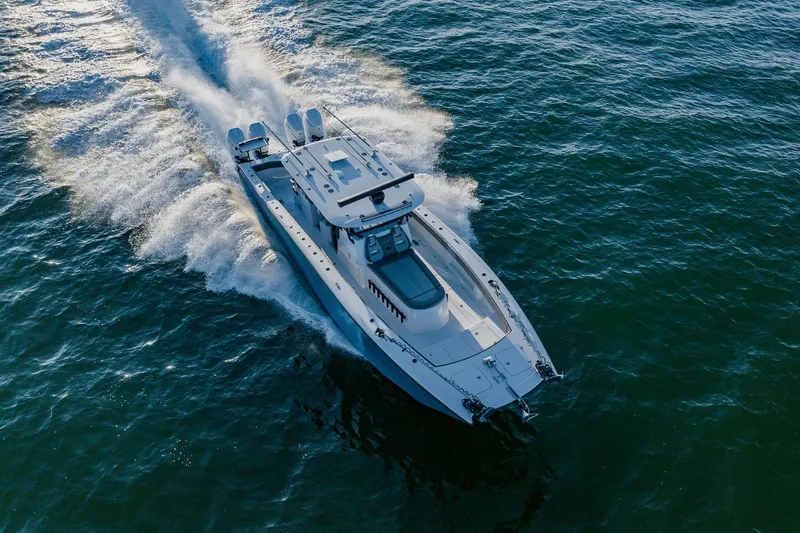 Reel Blessed Yacht Photos Pics Aerial view of 2025 Freeman 42LR boat cruising on open water.