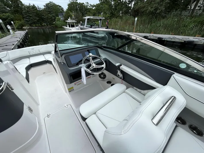  Yacht Photos Pics 2026 Regal LX4 boat interior with sleek white seating and modern dashboard.