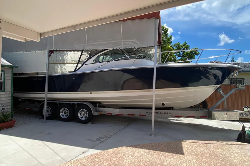  Yacht Photos Pics 2006 Pursuit 3480 Drummond Island Runner boat on trailer under canopy.