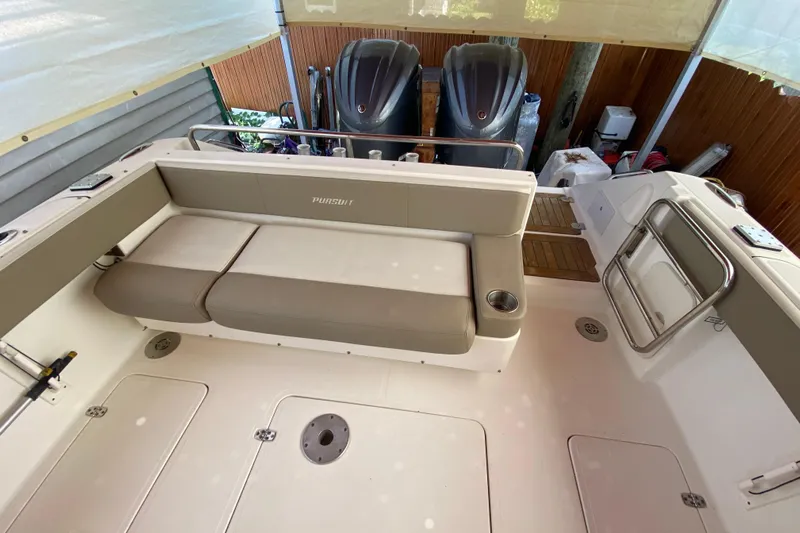  Yacht Photos Pics 2006 Pursuit 3480 Drummond Island Runner boat interior with seating and twin engines.