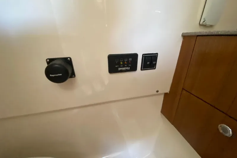  Yacht Photos Pics Control panel inside 2006 Pursuit 3480 Drummond Island Runner boat cabin.