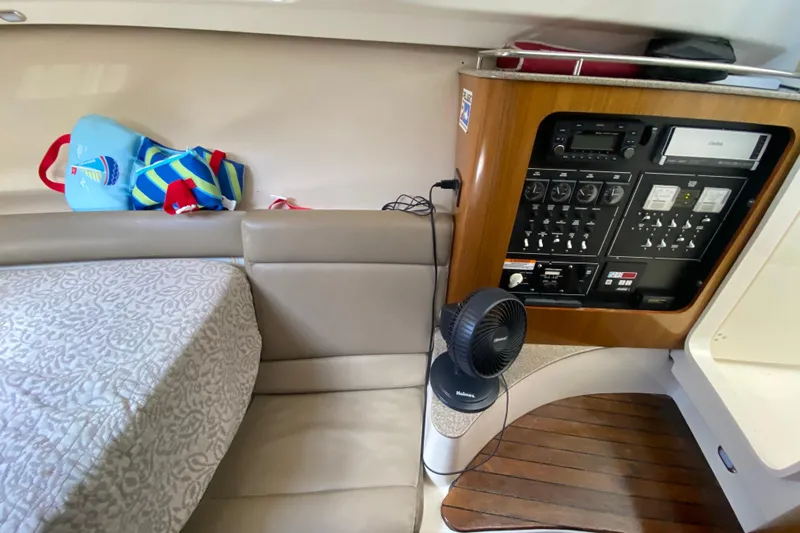  Yacht Photos Pics Interior of 2006 Pursuit 3480 Drummond Island Runner with control panel and seating area.