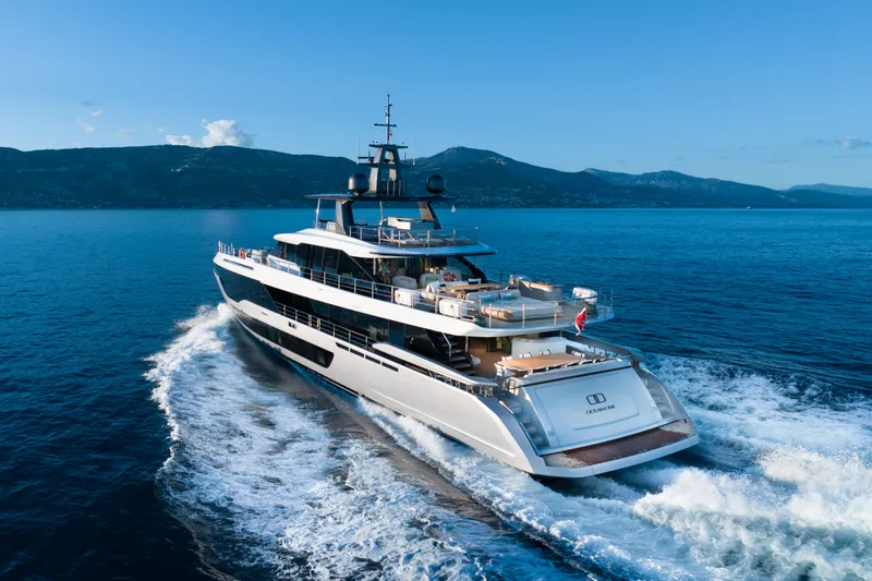 Ocean One Yacht Photos Pics Azimut Grande 36M yacht cruising on open sea, 2022 model, with scenic mountain backdrop.