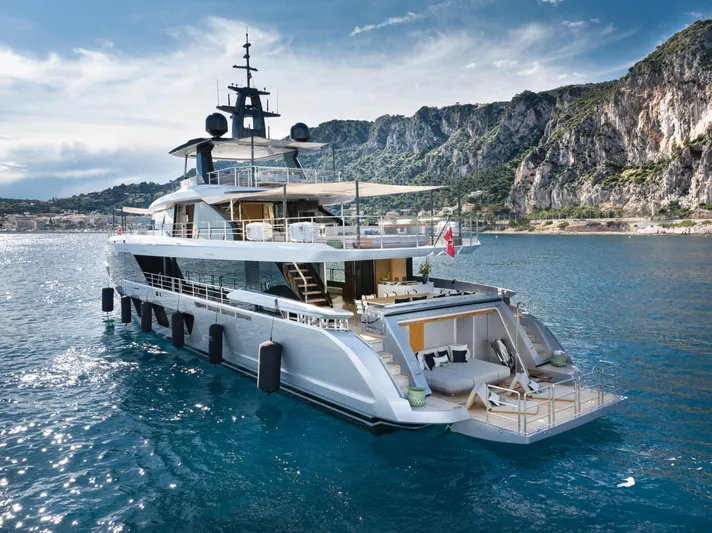 Ocean One Yacht Photos Pics Luxurious 2022 Azimut Grande 36M yacht cruising near scenic rocky coastline.