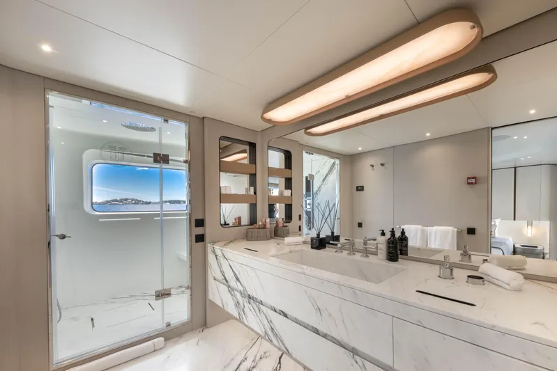 Ocean One Yacht Photos Pics Luxurious bathroom in 2022 Azimut Grande 36M yacht with marble countertops and modern fixtures.