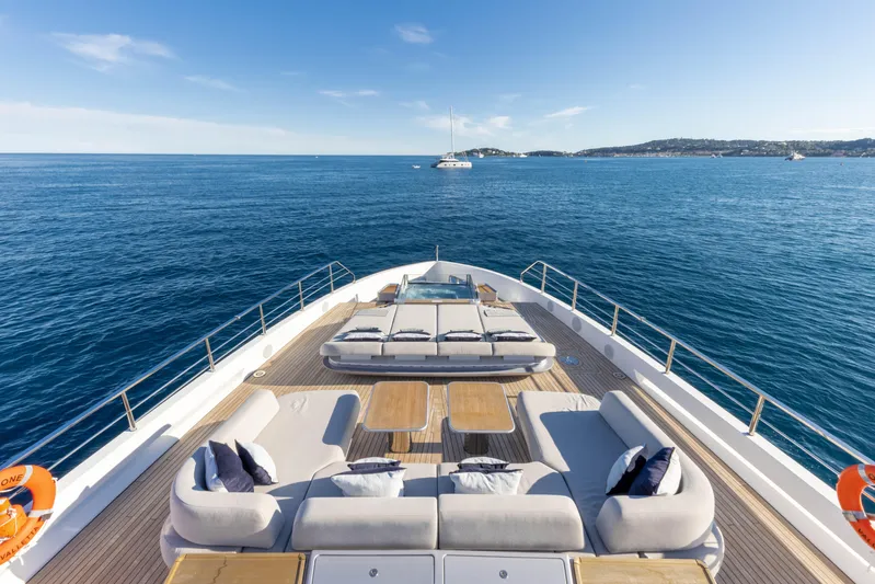 Ocean One Yacht Photos Pics Luxurious Azimut Grande 36M yacht deck with elegant seating, overlooking serene ocean waters.