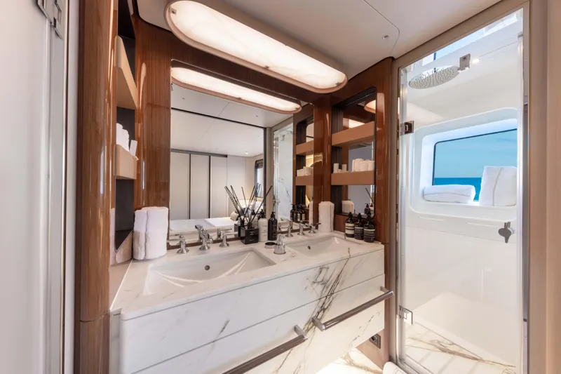 Ocean One Yacht Photos Pics Luxurious bathroom in 2022 Azimut Grande 36M yacht with marble sink and ocean view.