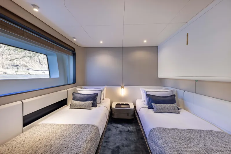 Ocean One Yacht Photos Pics Luxurious twin bedroom on 2022 Azimut Grande 36M yacht with modern decor and large window.