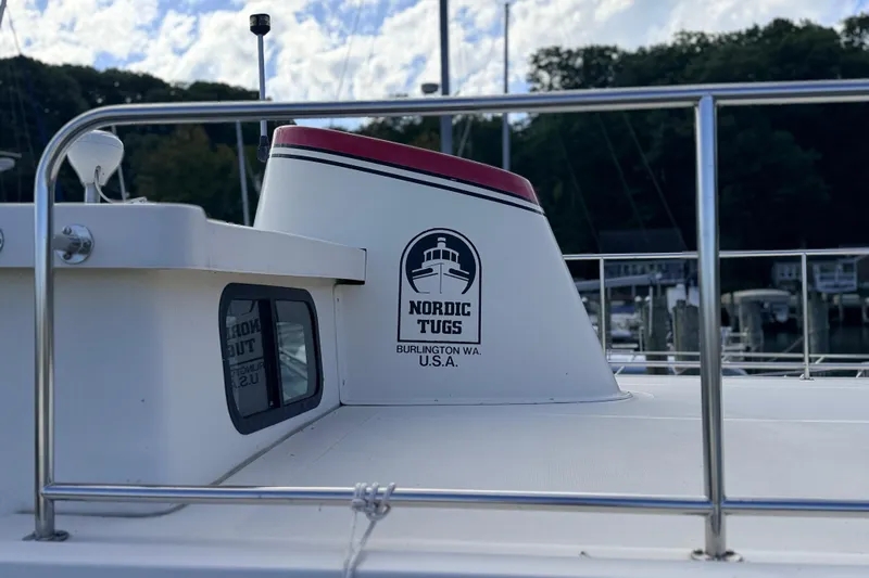 Nomad Yacht Photos Pics Nordic Tug 37 boat, 2000 model, docked with logo visible, Burlington WA, USA.