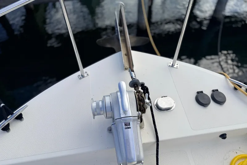 Nomad Yacht Photos Pics Nordic Tug 37 (2000) bow with anchor winch and deck fittings.