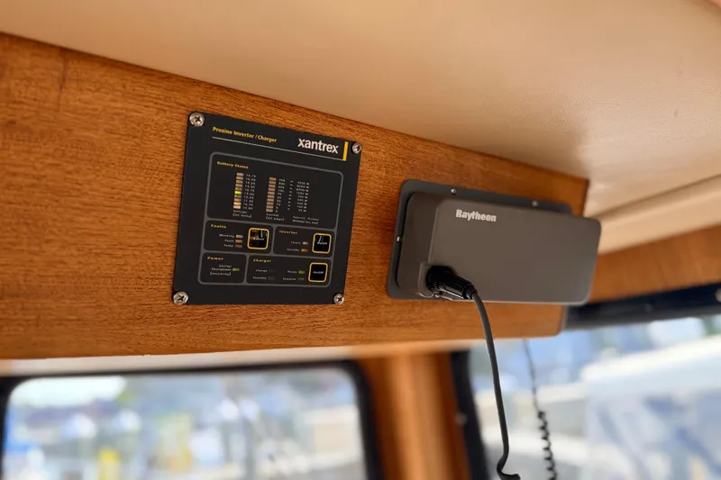 Nomad Yacht Photos Pics Control panel and device inside 2000 Nordic Tug 37 boat cabin.