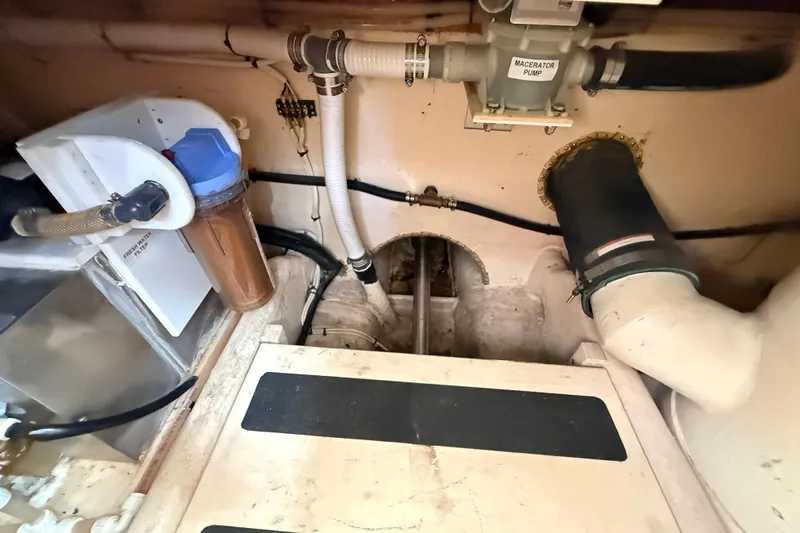 Nomad Yacht Photos Pics Engine room of 2000 Nordic Tug 37 with macerator pump and water filtration system.