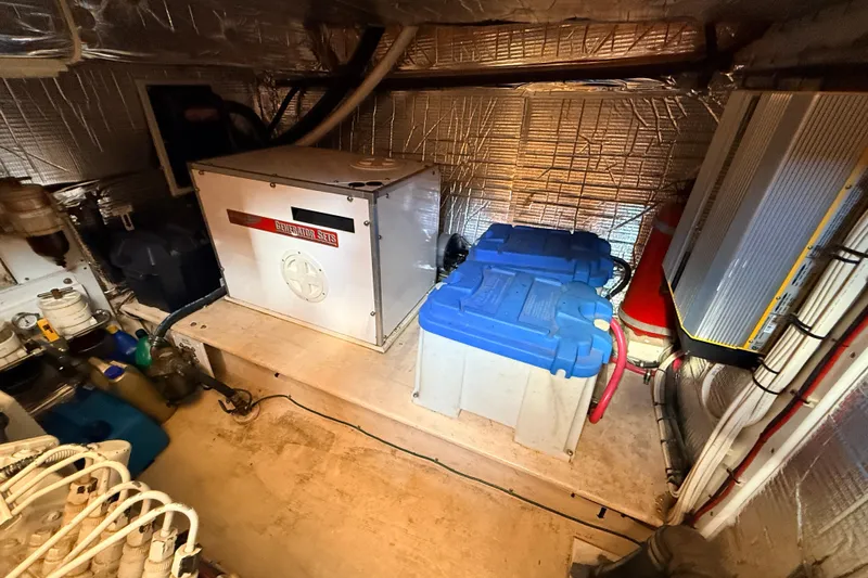 Nomad Yacht Photos Pics Engine room of a 2000 Nordic Tug 37 with generator and batteries.