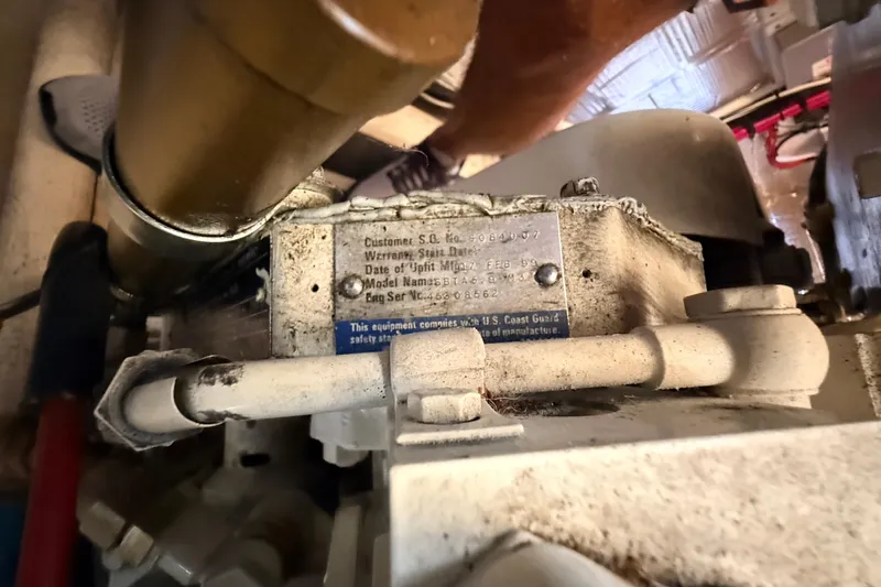 Nomad Yacht Photos Pics Engine compartment of a 2000 Nordic Tug 37 with visible identification plate.