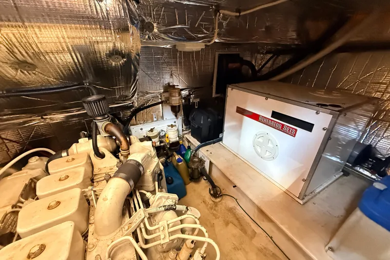 Nomad Yacht Photos Pics Engine room of 2000 Nordic Tug 37 with generator and insulation.