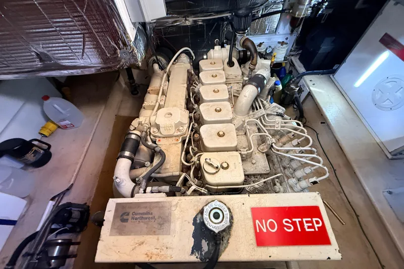 Nomad Yacht Photos Pics Engine room of a 2000 Nordic Tug 37 with Cummins engine, labeled "No Step."