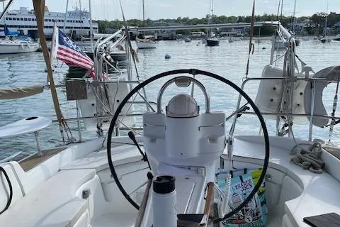 Peregrine Yacht Photos Pics Cockpit view of a 2005 Beneteau 423 sailboat docked in a marina.