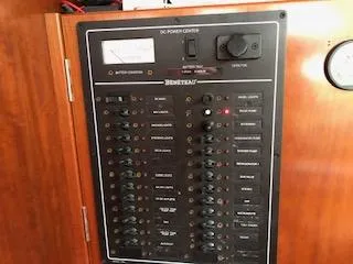 Peregrine Yacht Photos Pics Electrical panel of a 2005 Beneteau 423 yacht, featuring various switches and controls.