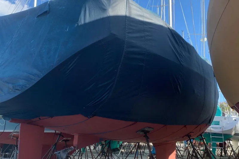 Peregrine Yacht Photos Pics 2005 Beneteau 423 sailboat covered and docked, viewed from below.