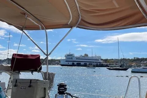Peregrine Yacht Photos Pics Sailboat view of harbor with ferry, Beneteau 423, 2005 model, sunny day.