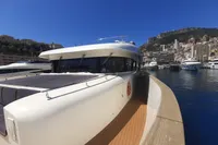Luxury yacht C.boat 27 SC, 2011 model, docked in a scenic marina.
