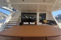 Spacious deck of 2011 Custom C.boat 27 SC with seating and stairs.