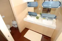Luxurious bathroom in 2011 Custom C.boat 27 SC yacht with dual sinks and modern design.