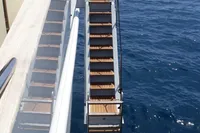 Custom C.boat 27 SC yacht with wooden stairs over blue ocean, 2011 model.