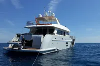 Luxurious 2011 Custom C.boat 27 SC yacht on open sea under clear blue sky.