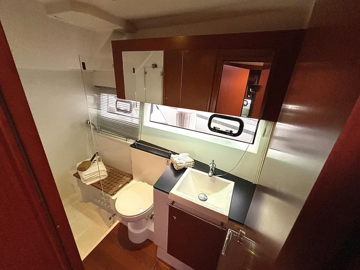  Yacht Photos Pics 2014 Jeanneau NC 14 yacht bathroom with modern fixtures and sleek design.