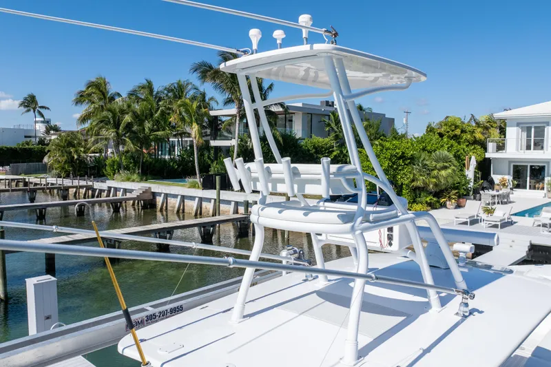  Yacht Photos Pics 2015 Intrepid 400 Center Console boat docked near waterfront homes.