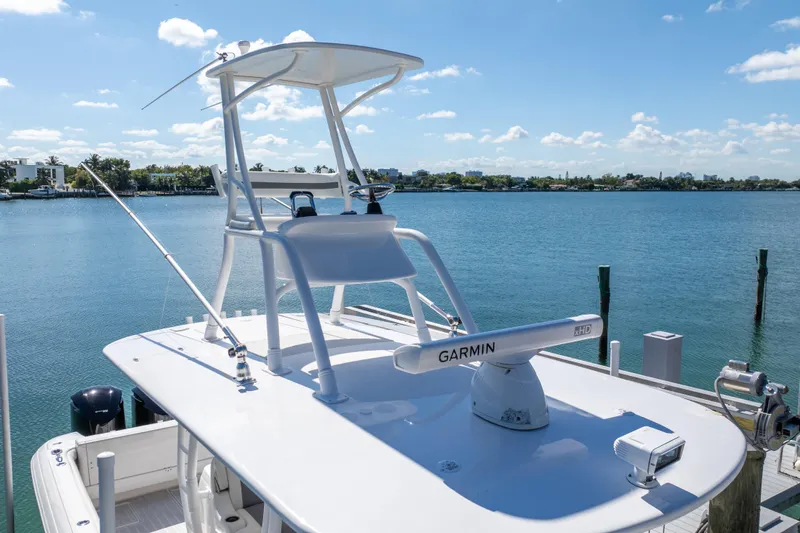  Yacht Photos Pics 2015 Intrepid 400 Center Console boat with Garmin radar, docked by a scenic waterfront.