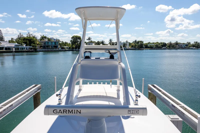  Yacht Photos Pics 2015 Intrepid 400 Center Console boat docked with Garmin radar, scenic waterfront view.