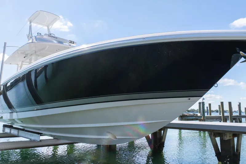  Yacht Photos Pics 2015 Intrepid 400 Center Console boat docked, showcasing sleek design and modern features.