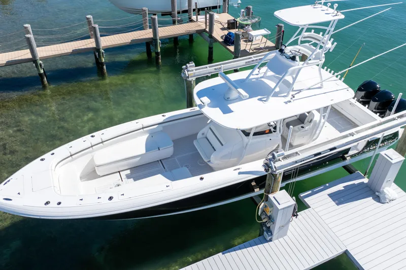  Yacht Photos Pics 2015 Intrepid 400 Center Console boat docked in clear water, aerial view.
