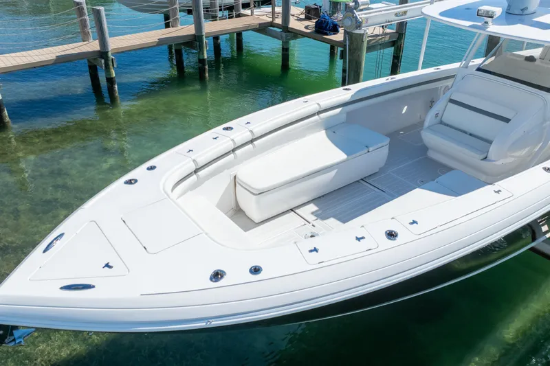  Yacht Photos Pics 2015 Intrepid 400 Center Console boat docked in clear water.