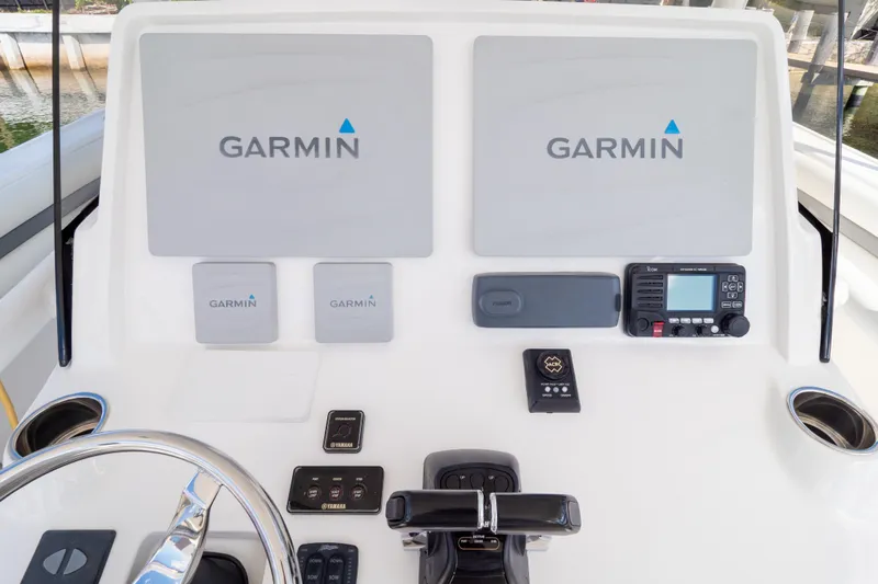  Yacht Photos Pics Control panel of 2015 Intrepid 400 Center Console with Garmin navigation displays.